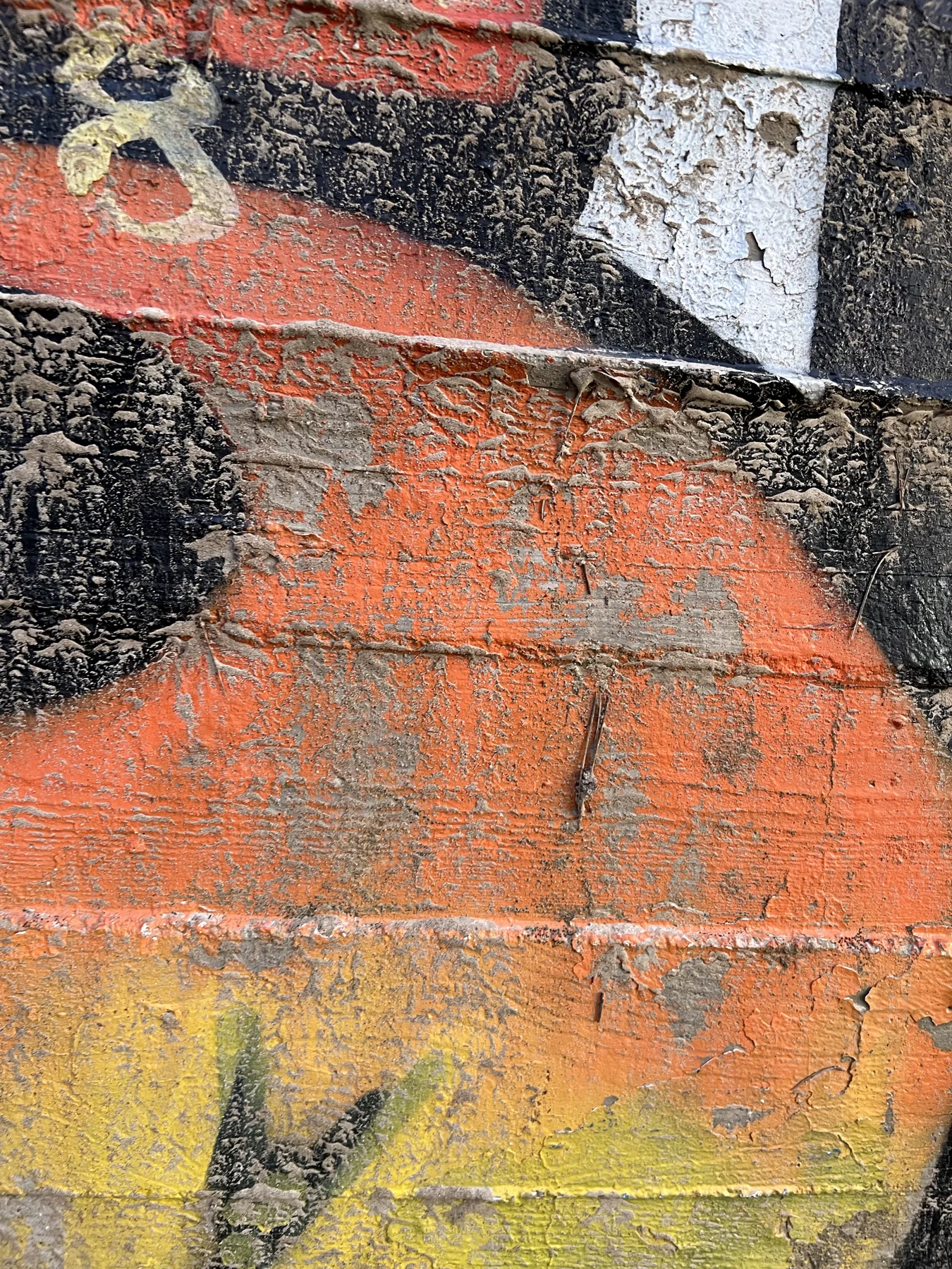 Painted wall fragment — orange and black, 8 visible in upper corner
