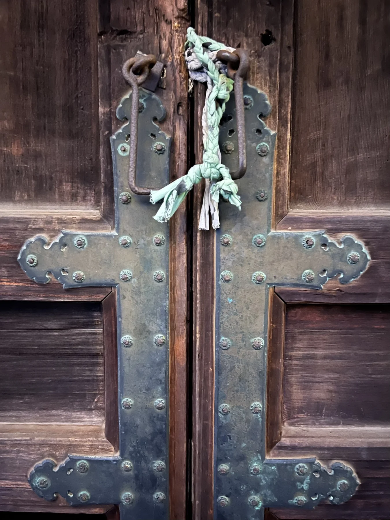 Ancient shrine doors with iron hardware and rope fastening
